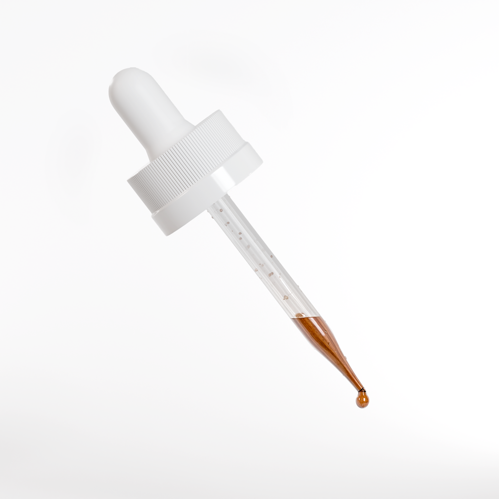 Ixora Life Peptide Hair Growth Serum — close-up of amber serum in a dropper