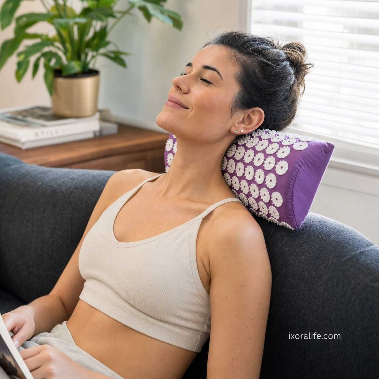 Woman using acupressure pillow for neck and shoulder comfort