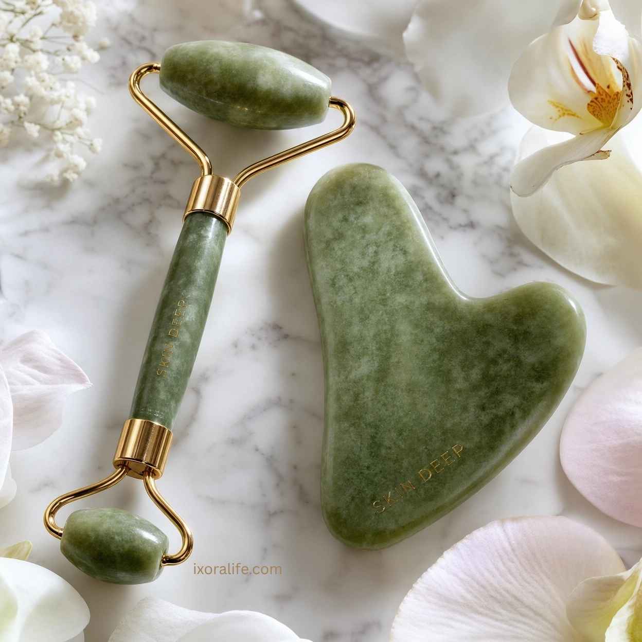 Jade roller and gua sha stone tools on marble surface showing product quality